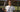 Woman holding a Mantis tennis racket on outdoor tennis court focusing on buying a tennis racket guide