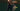 Blurred action shot of a tennis player demonstrating forehand technique with racquet hitting a tennis ball