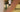 man standing on tennis court holding racquet viewed through blurred arms demonstrating tennis lessons for beginners