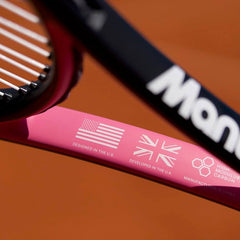 Close-up of Mantis tennis racket frame highlighting design and development origins with USA and UK flags and high modulus carbon label against a tennis court background.