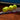 Tennis racket with five yellow tennis balls on clay court, illustrating how to compare tennis rackets for game performance.
