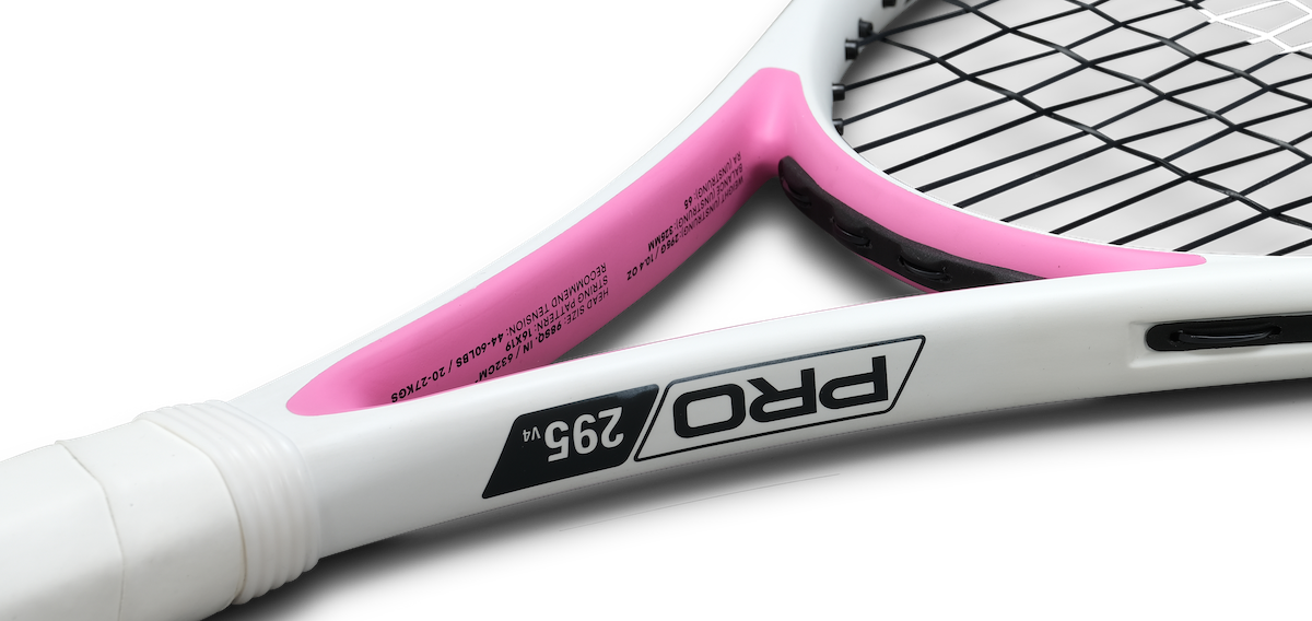 Close-up of a white and pink PRO 295 V4 junior tennis racket frame and strings.