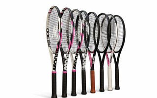Set of carbon fibre tennis rackets with various grip colors and designs on white background