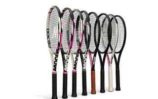 Row of carbon fibre tennis rackets with black handles and various designs on the frames against a white background