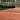 Empty tennis clay court with net ready for play, ideal for expert tennis instruction and training