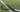 beginner tennis racket Mantis on grass court with white grip and pink accents