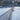 empty tennis court with net and clear court lines on sunny day