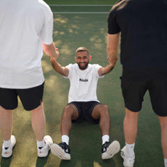Three men on court performing tennis strength training exercise 
