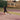 Tennis player performing spider drill sprint on court for conditioning and agility training