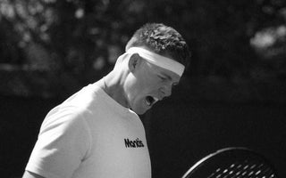 tennis player showing intense focus and determination representing mental toughness on court