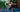 Modern padel court with glass walls and artificial turf under LED lighting