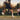 tennis player practicing hand eye coordination with coach on outdoor court